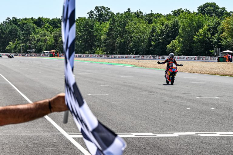 Jose Antonio Rueda takes the flag