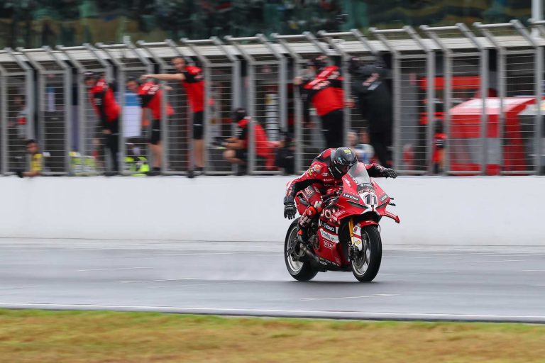 Bulega swimming over line